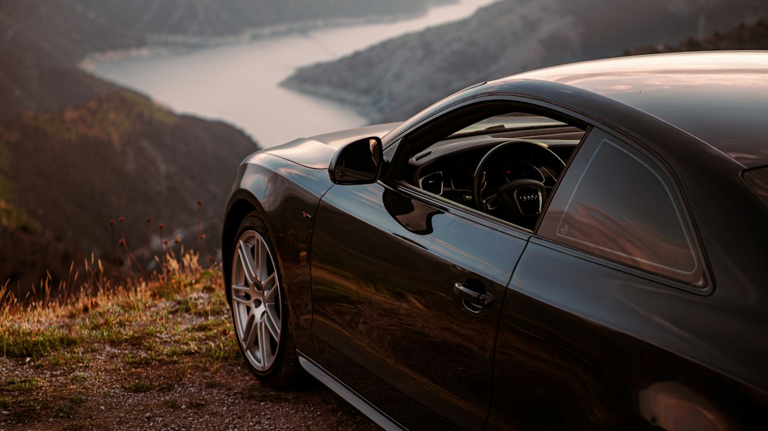 Car overlooking a scenic mountain road